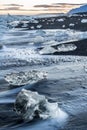 Ice lumps at a black beach