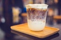 Ice Macchiato coffee cup on the wood plate at coffee shop Royalty Free Stock Photo