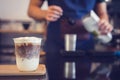 Ice Macchiato coffee cup on the wood plate at coffee shop. Barista background Royalty Free Stock Photo