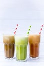 Ice milk coffee, green tea, Iced Thai milk tea drink in tall glasses isolated on white wooden table background, drinks so