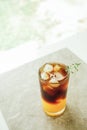 The ice of orange juice and black coffee on grey marble, Summer drinks for Asian people. Vertical photo Royalty Free Stock Photo