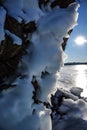 Ice over the rocks. Ice over rocks wall on Baikal lake at winter. Royalty Free Stock Photo