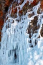 Ice over rocks wall on Baikal lake at winter Royalty Free Stock Photo