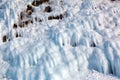 Ice over rocks wall on Baikal lake at winter Royalty Free Stock Photo