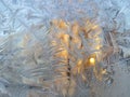 Ice pattern and sunlight on winter glass Royalty Free Stock Photo