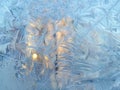 Ice pattern and sunlight on winter glass Royalty Free Stock Photo