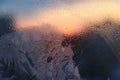 Ice patterns, water drops and sunlight on glass Royalty Free Stock Photo