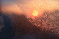 Ice patterns, water drops and sunlight on a window glass Royalty Free Stock Photo