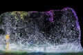 Ice plate melting, Multi colored ice on black background. 02 Royalty Free Stock Photo