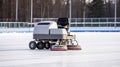 Ice resurfacing machine smoothes skating rink with precision and efficiency.AI Generated
