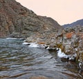 Ice rim on rocky banks of the river, Gorny Altai, Siberia, Russia