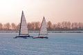 Ice sailing on a cold winter day on the Gouwzee in the Netherlands at sunset Royalty Free Stock Photo