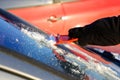 Ice scraping - removing ice and snow from car Royalty Free Stock Photo