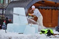 Ice sculptor carves artwork during competition