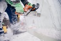 Ice sculpture carving man use chainsaw cut frozen winter Royalty Free Stock Photo
