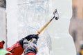 Ice sculpture carving man use chisel cut frozen winter Royalty Free Stock Photo