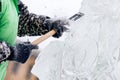Ice sculpture carving man use chisel cut frozen winter Royalty Free Stock Photo
