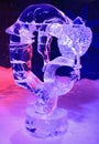 Ice sculpture of dragon and girl, illuminated at night in Confederation Park, Winterlude Event in Ottawa