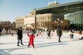 Ice skaters enjoying a sunny December afternoon