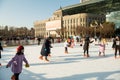 Ice skaters enjoying a sunny December afternoon