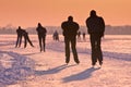 Ice Skaters under setting sun Royalty Free Stock Photo