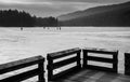 Ice skaters on the frozen surface of Cowans Gap Lake, near McConnellsburg, Pennsylvania. Royalty Free Stock Photo