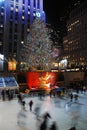 Ice skaters glide past the lighted Christmas tree in Rockefeller Center, New York City Royalty Free Stock Photo