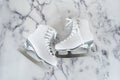 Ice skates on marble background Royalty Free Stock Photo