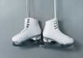 Ice skates shoes on gray background Royalty Free Stock Photo