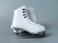 Ice skates shoes on gray background Royalty Free Stock Photo