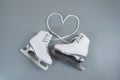 Ice skates shoes on gray background Royalty Free Stock Photo