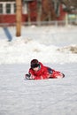 Ice skating boy fell down on the rink Royalty Free Stock Photo