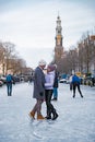 Ice skating on the canals in Amsterdam the Netherlands in winter, frozen canals in Amsterdam during winter Royalty Free Stock Photo