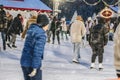 Ice Skating at Christmas holiday, people ice skating in park. Winter sport Royalty Free Stock Photo