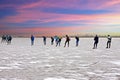 Ice skating on a cold snowy winterday in the countryside from the Netherlands at sunset Royalty Free Stock Photo