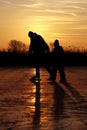 Ice skating on a frozen lake in the Netherlands Royalty Free Stock Photo