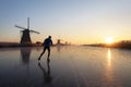 Ice skating at sunrise in the Netherlands Royalty Free Stock Photo