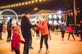 Ice skating together. Romantic winter vacation in ice arena. Young couple skating at ice rink. Best Christmas ever. Winter fun.