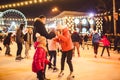 Ice skating together. Romantic winter vacation in ice arena. Young couple skating at ice rink. Best Christmas ever. Winter fun.