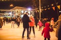 Ice skating together. Romantic winter vacation in ice arena. Young couple skating at ice rink. Best Christmas ever. Winter fun.