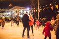 Ice skating together. Romantic winter vacation in ice arena. Young couple skating at ice rink. Best Christmas ever. Winter fun.