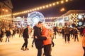 Ice skating together. Romantic winter vacation in ice arena. Young couple skating at ice rink. Best Christmas ever. Winter fun.