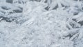 Ice and snow crystals forming spike shapes on frozen river, closeup macro detail, abstract winter background Royalty Free Stock Photo