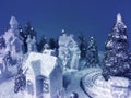 Ice and snow sculpture winter composition on blue background