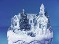 Ice and snow sculpture winter composition on blue background