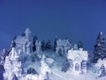 Ice and snow sculpture winter composition on blue background