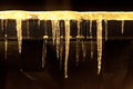 Ice stalactites lite by the street lights Royalty Free Stock Photo