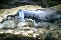 Ice stalactites, stalagmites and columns in cave