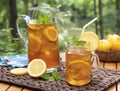 Ice tea in glass jar and pitcher with lemon and mint Royalty Free Stock Photo