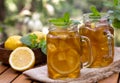 Ice tea in glass jars with lemon and mint Royalty Free Stock Photo